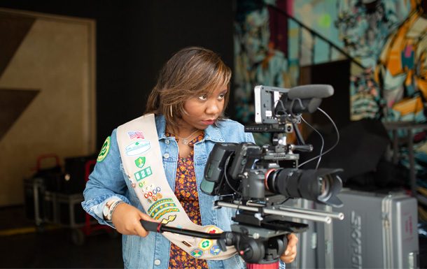 girl scout with news camera